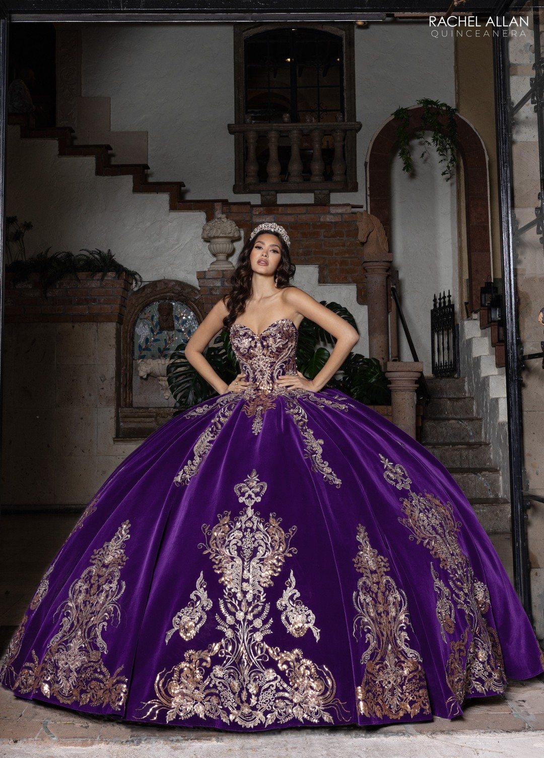 Deep purple quinceañera dress with silver beading, corset bodice, and layered shimmer skirt